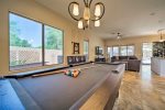 Play pool in the home`s open floor plan layout. 